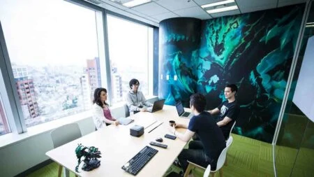 Riot Games employees working in their office