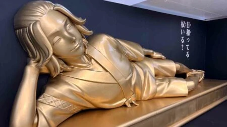 Golden Mikey in reclining Buddha pose at Tokyo Revengers Exhibition
