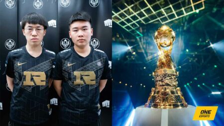 Royal Never Give Up's Xiaohu and Wei next to MSI trophy