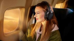 Woman using the Razer Barracuda Pro on the airplane