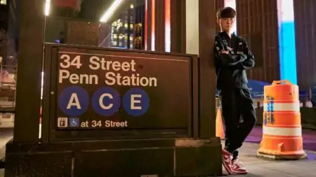 T1 Faker at Worlds 2022 posing with Penn Station sign in New York City