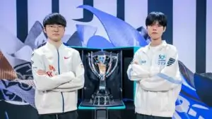 DRX Deft and T1 Faker posing next to Worlds 2022 trophy