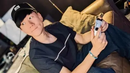 JJ Lin holding a PS5 Sony PlayStation controller