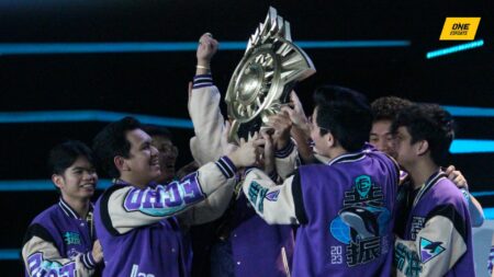 ECHO members hold the M4 World Championship trophy