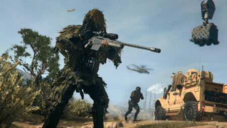 Player in a ghillie suit holds sniper in Warzone 2