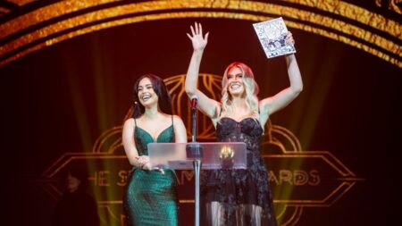 QTCinderella and Valkyrae laugh on stage at the Streamer Awards 2023