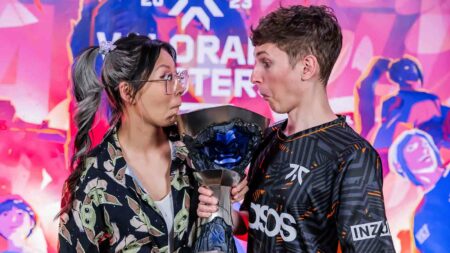 Esports host Yinsu "Yinsu" Collins (L) and Jake "Boaster" Howlett of Fnatic pose with the VALORANT Masters Tokyo Grand Finals Trophy at Makuhari Messe on June 25, 2023 in Chiba, Japan