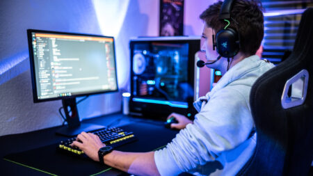 Gamer browsing Discord on his PC setup