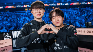 ATLANTA, GEORGIA - OCTOBER 29: Lee "Faker" Sang-hyeok (L) and Ryu "Keria" Min-seok of T1 pose onstage after victory against JD Gaming at the League of Legends World Championship Semifinals on October 29, 2022 in Atlanta, GA.