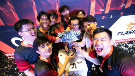 Members of Team Flash holding the MPL SG Season 6 championship trophy