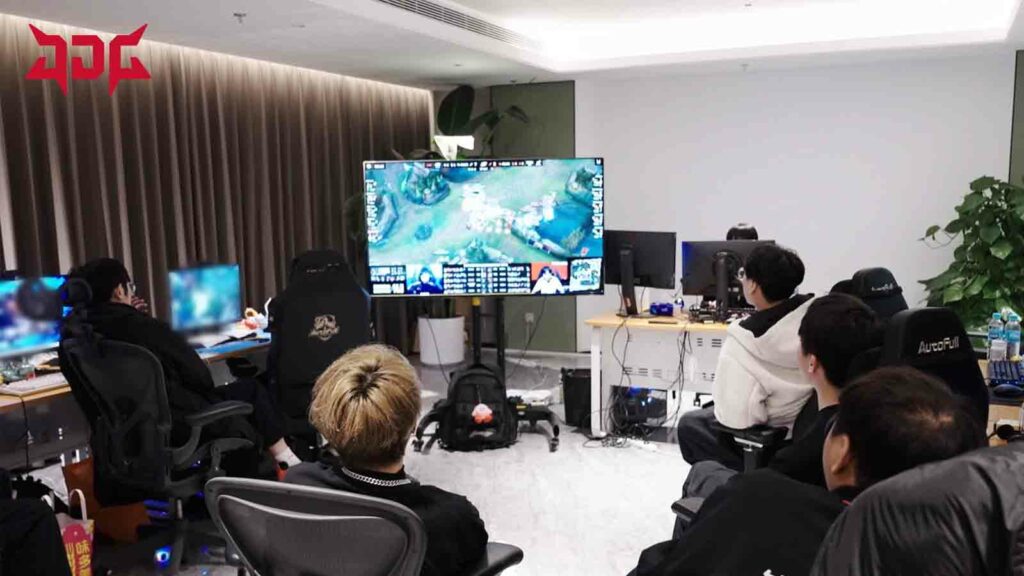 JD Gaming reviewing a game on screen during LPL Spring 2024