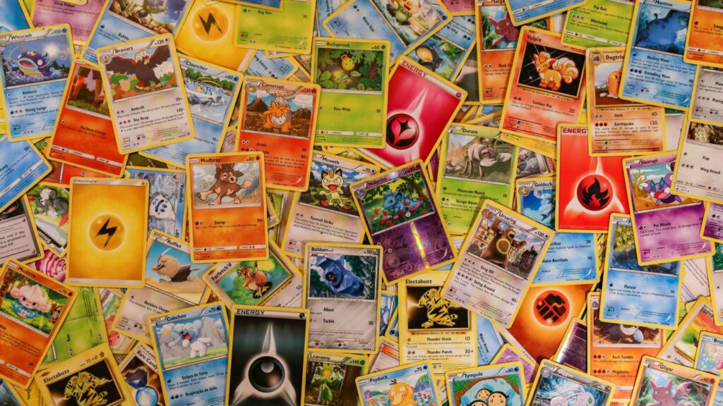 Various Pokemon TCG cards spread out on a table by Mick Haupt on Unsplash