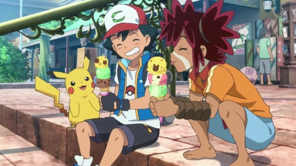 Ash and Koko sitting on steps smiling in Pokemon movie Secrets of the Jungle