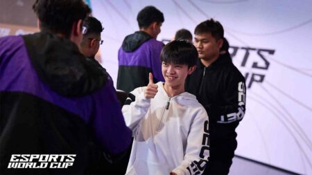 Team Secret pro player Ong Ee "Son" Son giving the thumbs up as he shakes hands with Vivo Keyd Stars at Esports World Cup