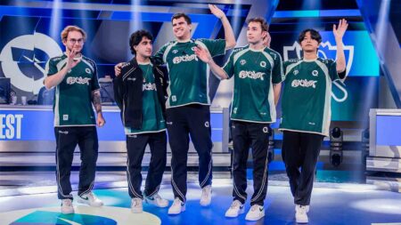 FlyQuest waving on stage after victory over Team Liquid at Worlds 2024 Swiss stage where they qualified for the Knockout stage