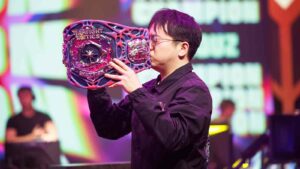 TFT Macao Open 2024 champion Shiquz kissing Arcane Teamfight Tactics esports trophy