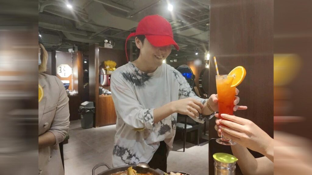 Invictus Gaming League of Legends player Rookie serving customer at his Korean restaurant in Shanghai