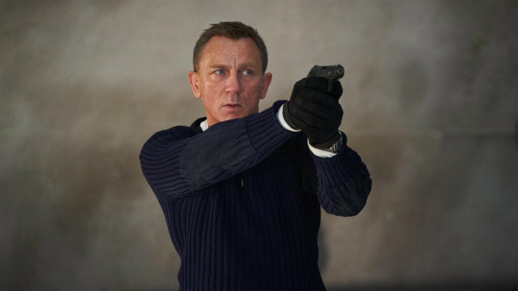 James Bond holding a pistol in No Time To Die