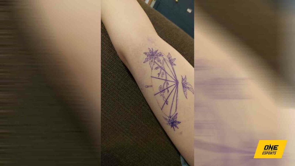 Tania Mae's arm with an outline of her Heaven Official's Blessing tattoo