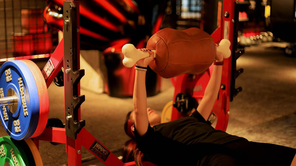 One Piece gym member using meat-shaped weights