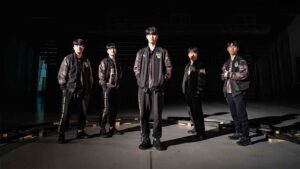 Gen.G at LCK Spring 2024 final featured photoshoot standing straight under spotlight lighting