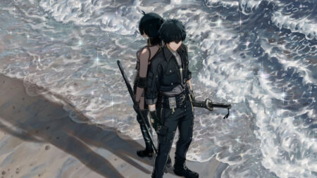 Male and female Rovers standing back to back near the ocean