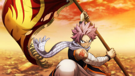 Fairy Tail's Natsu Dragneel holding a flag bearing the Fairy Tail guild symbol.