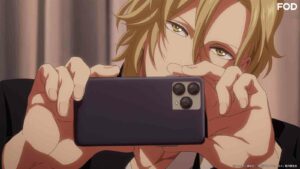Still of Hisashi Ootomo holding his phone filming in the infirmary in Twilight Out of Focus episode 3