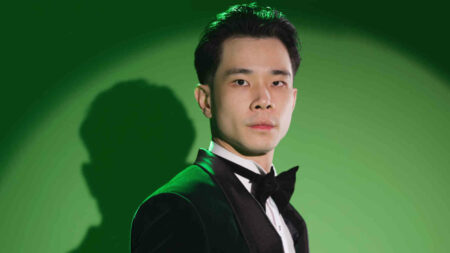 Jess No Limit in suit and bowtie recognized as Forbes 30 Under 30 Asia